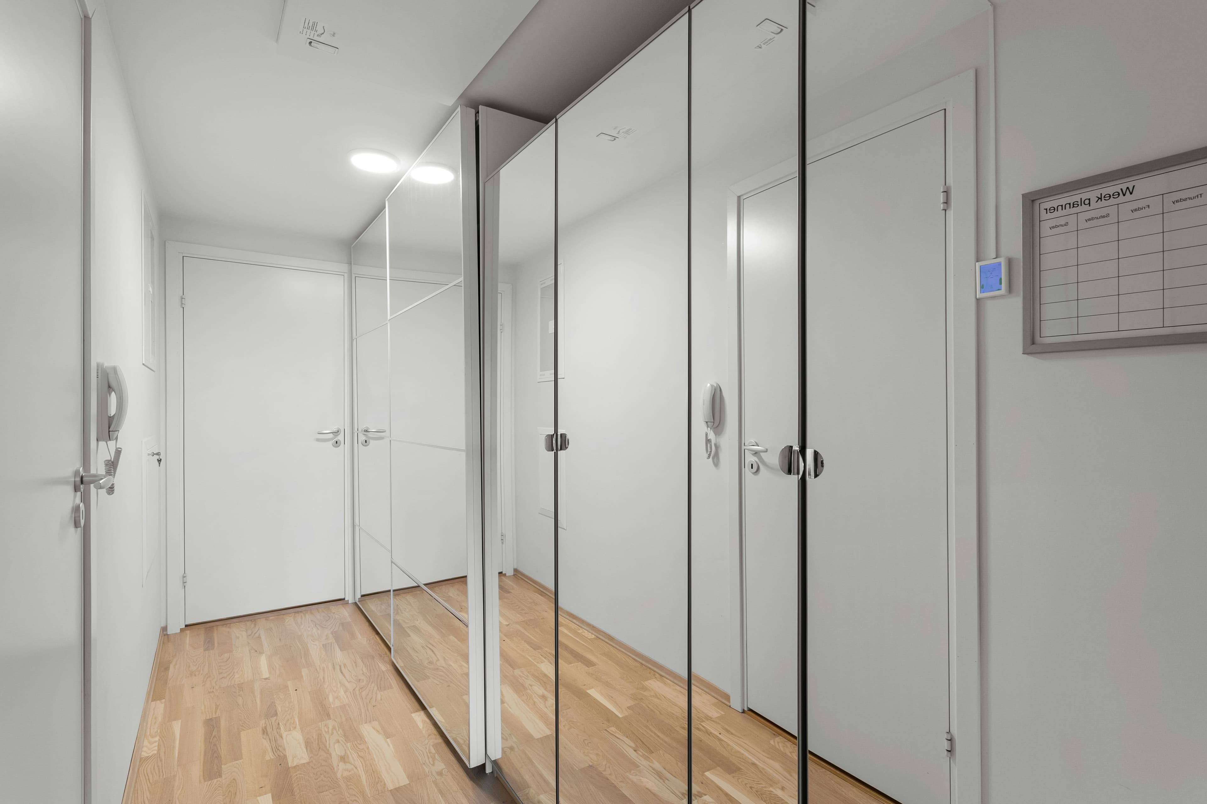 Large custom bathroom mirror with aluminum mounting system and design integration