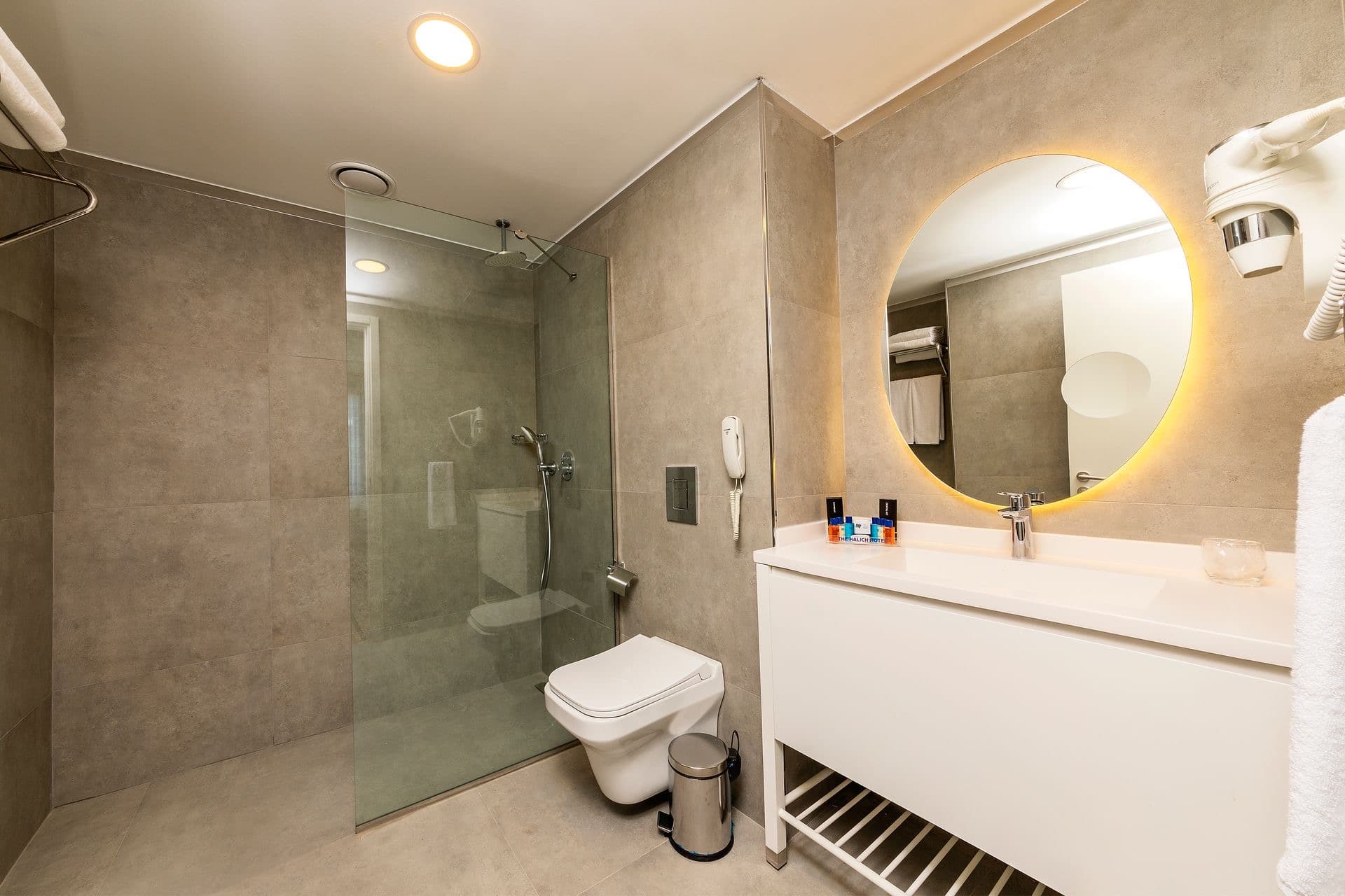 Homeowner consulting with North Glass Interior Architect about custom shower door options, demonstrating professional buying guidance