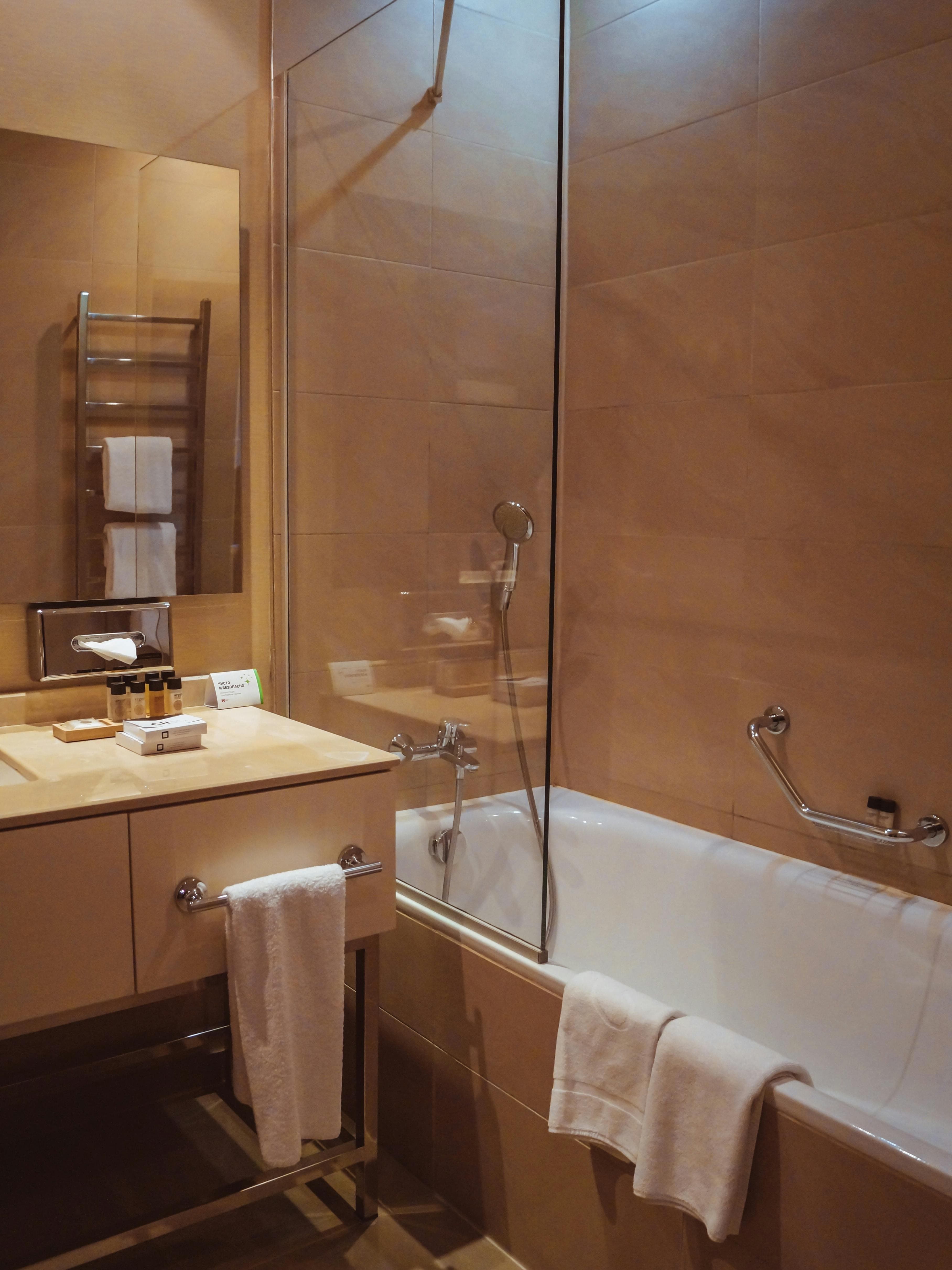 Modern frameless glass shower door installation with contemporary styling in Durham home